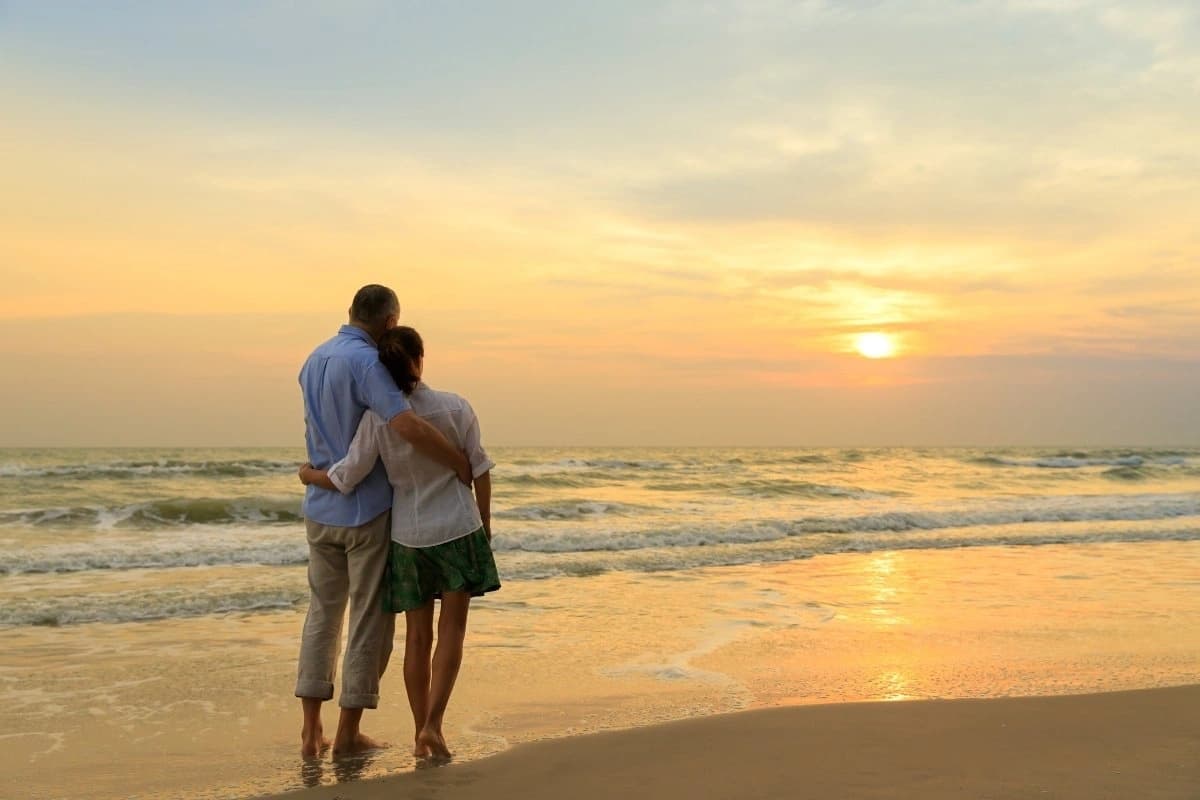 Couple watching the sunset at Panama City Beach.